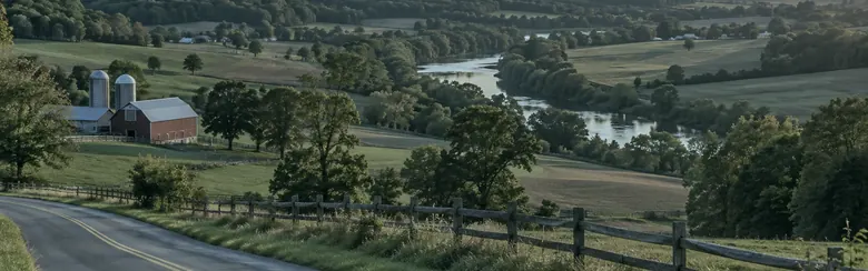 Illustration of a valley with farmland, a barn and a river.